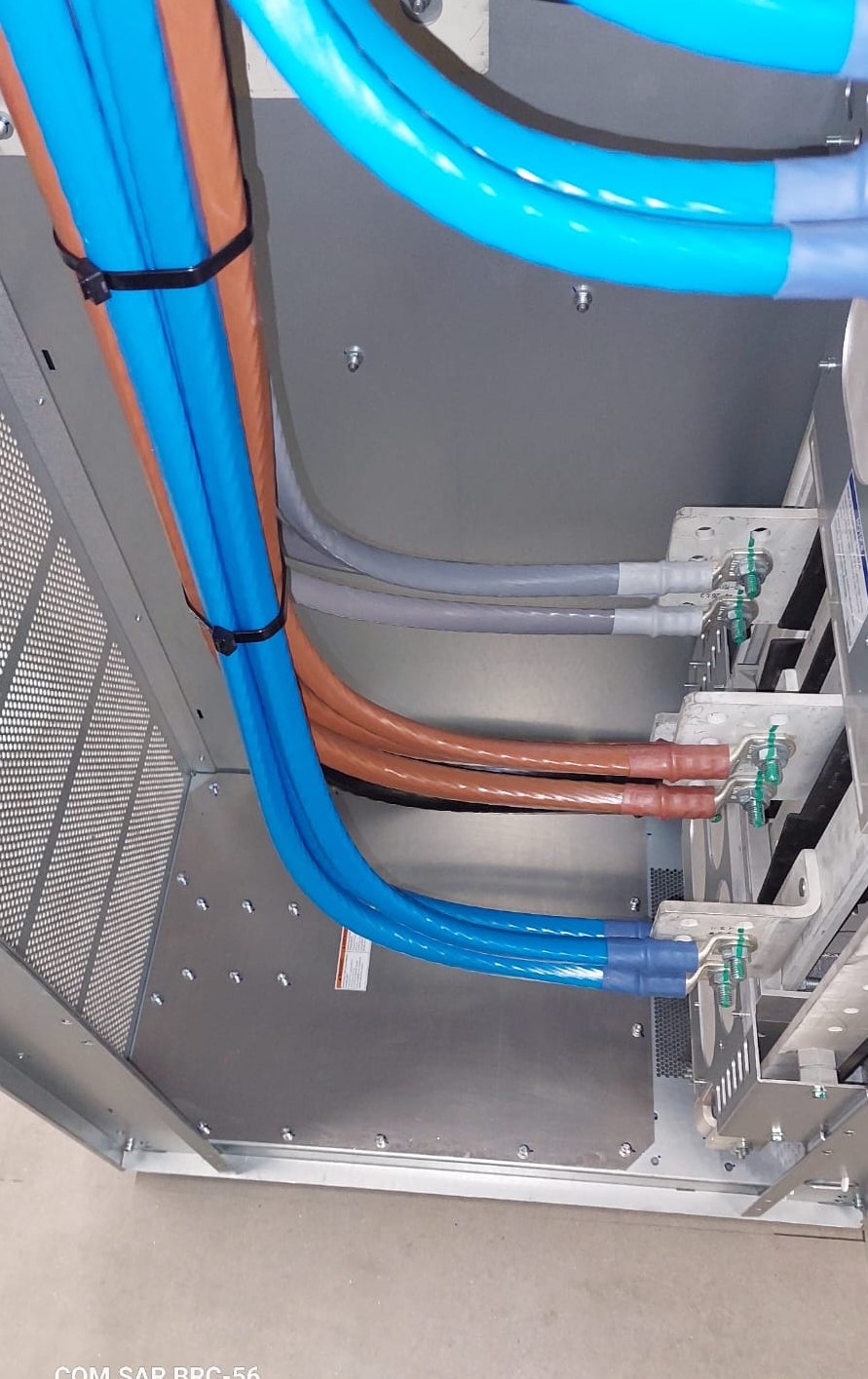 COM.SAR IT Cleaning project photograph: grouped power cables and their terminations inside switchgear. COM.SAR IT Cleaning project photograph: grouped power cables and their terminations inside switchgear.