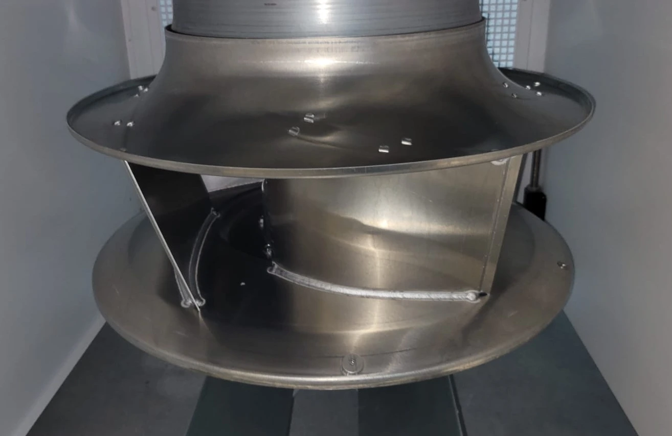 Metal fan impeller inside a CRAH unit. Metal fan impeller inside a CRAH unit.