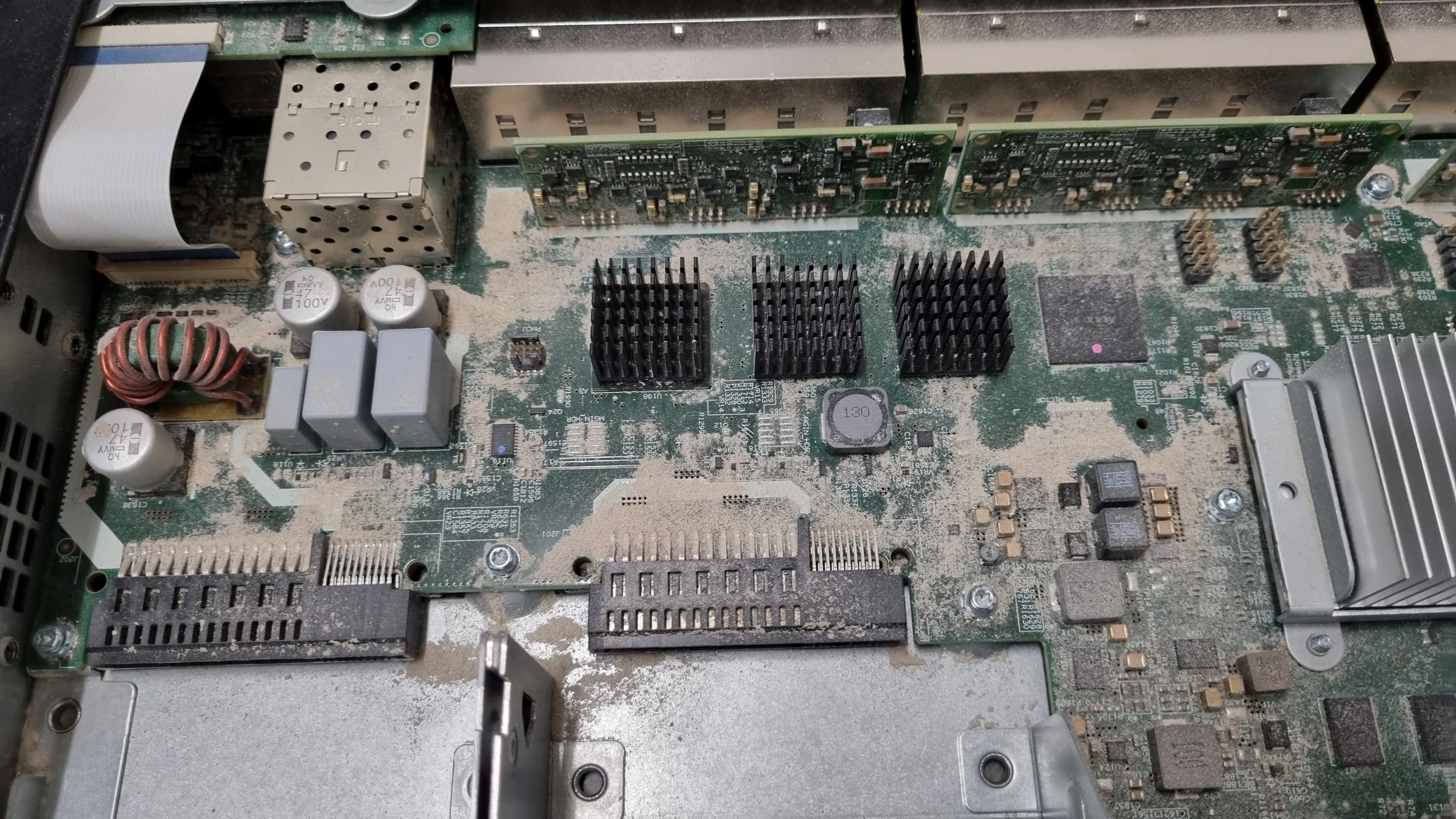 Cleaning the equipment circuit board and enclosure interior, before cleaning with heavy dust deposits.