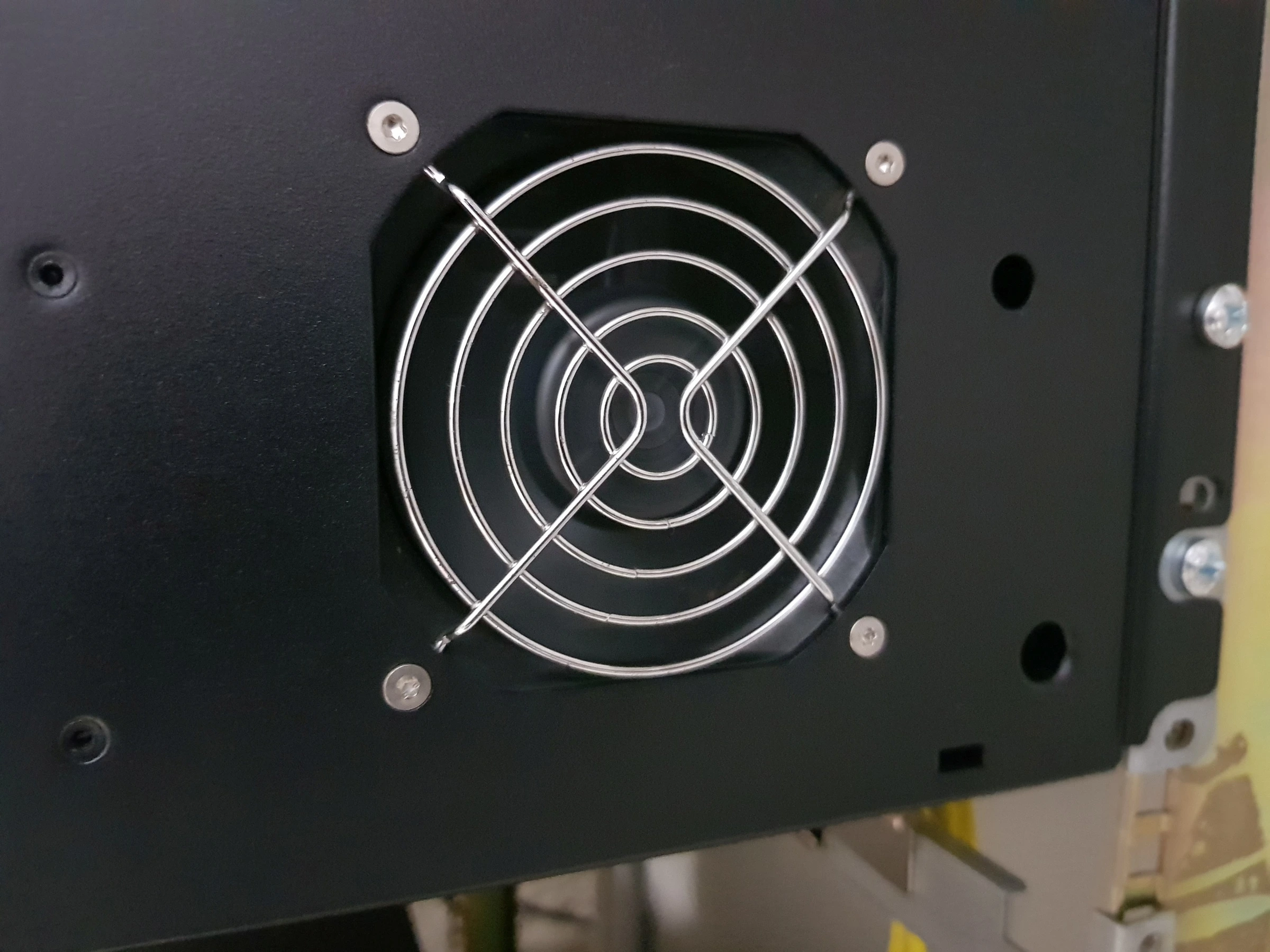 Cleaning the fan grille and enclosure surface, after cleaning.